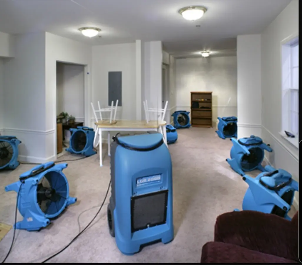 Air movers and dehumidifier setup for Water Extraction & Removal in Brick